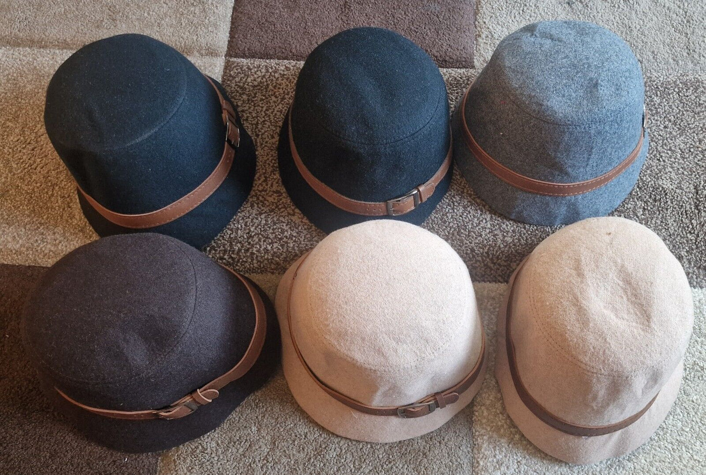 Collection of 1940s vintage women's hat in various colours with brown leather band