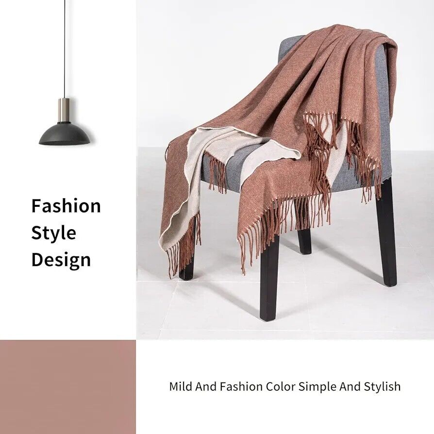 Stylish Australian wool throw blanket draped over a grey chair with a fashionable design