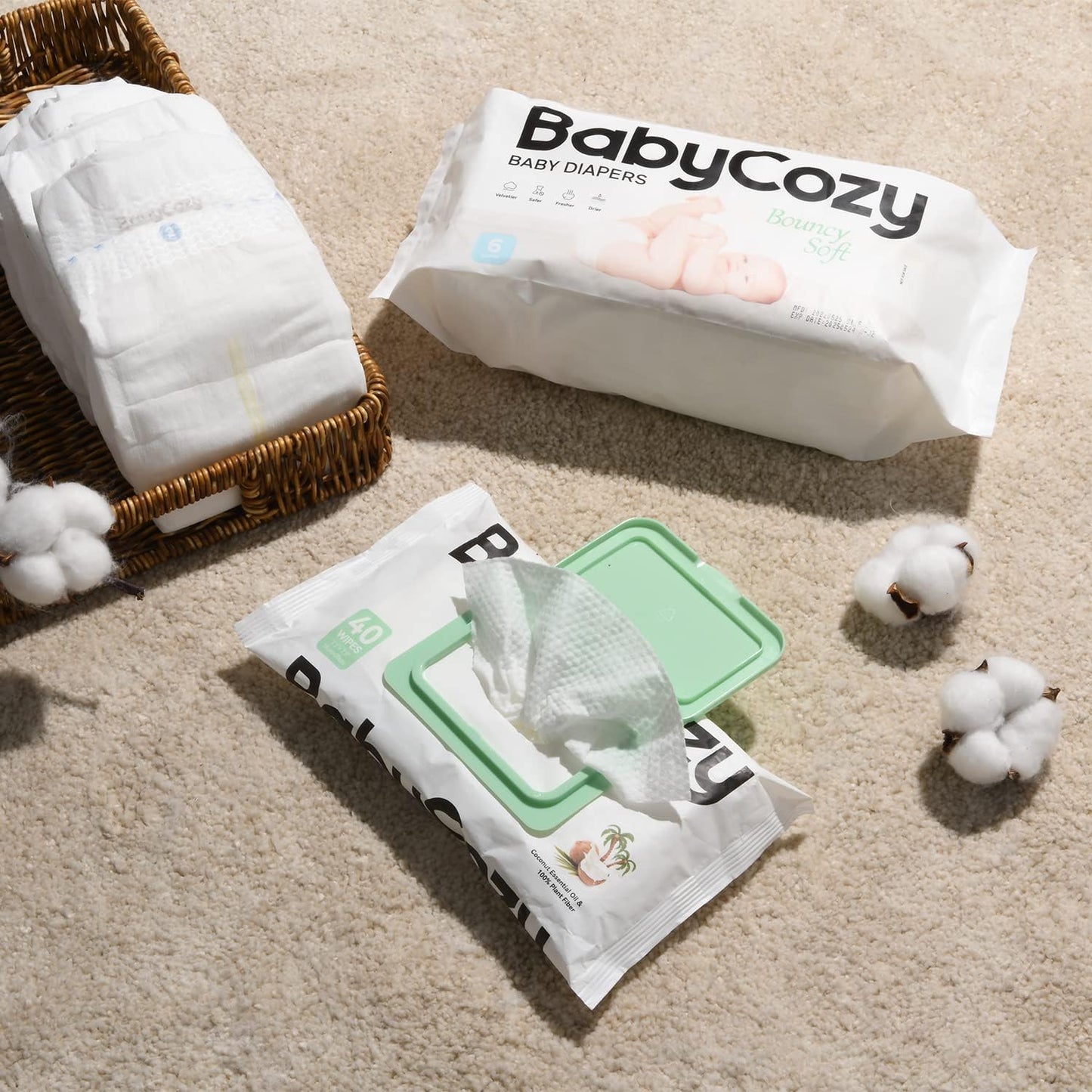 Babycozy size 3 diapers in a pack with a green lid on a soft carpet, surrounded by cotton balls