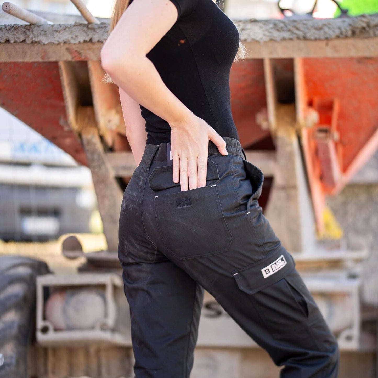 Black Hammer cargo pants size 14 worn by a woman in a black top showing side and back pockets