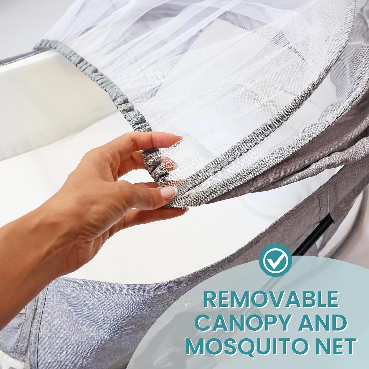 Hand adjusting the removable canopy and mosquito net of a portable baby travel bassinet by Blue Zeri
