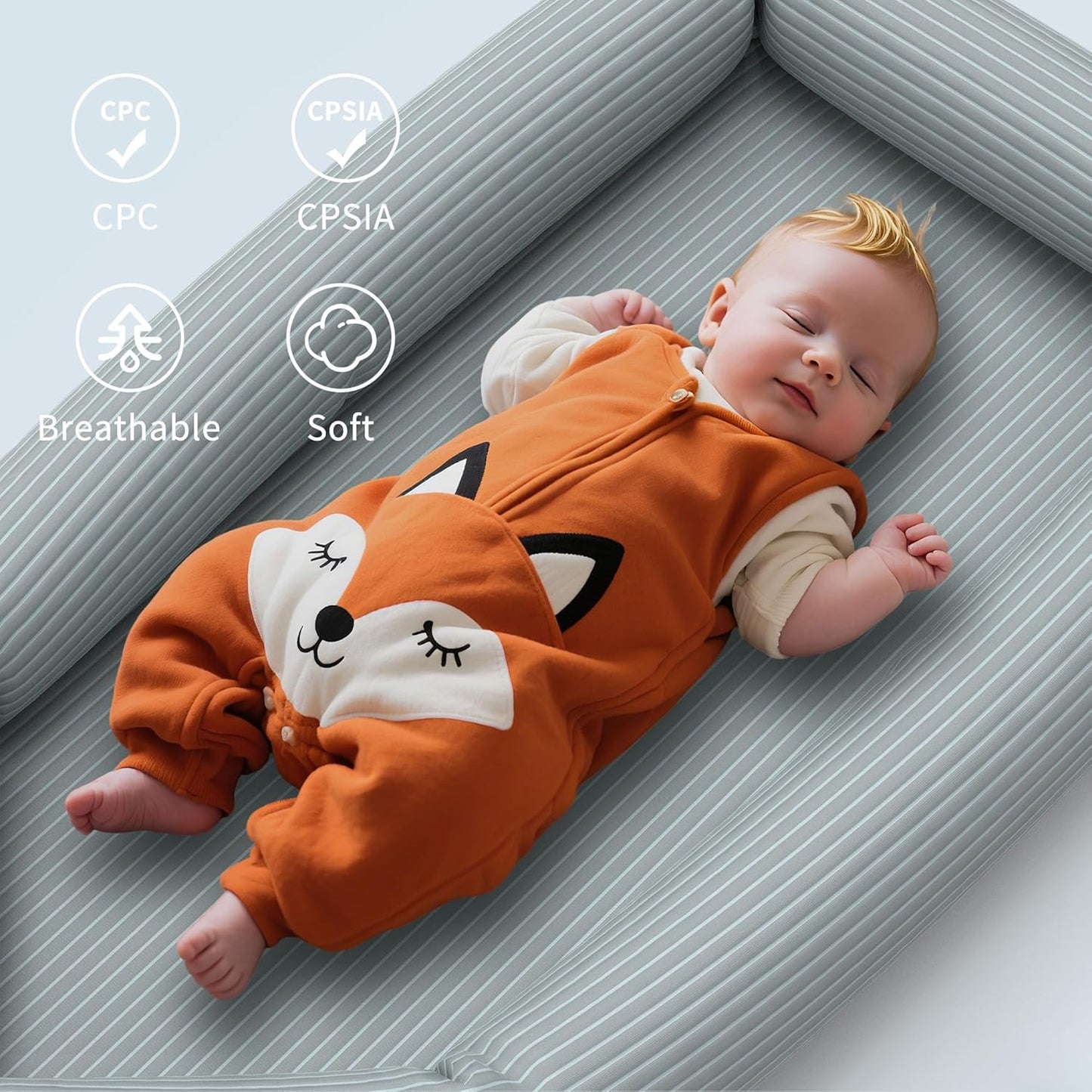Breathable baby lounger for newborns with soft protective edges and a sleeping baby in a fox onesie