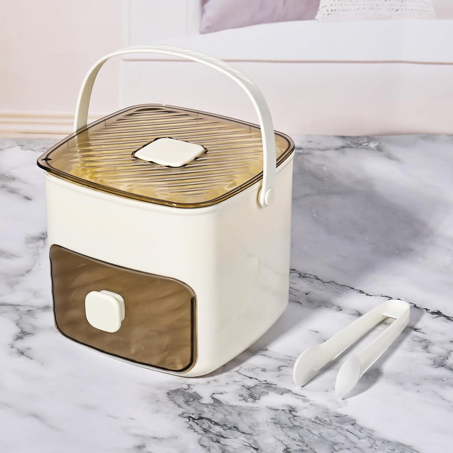 Countertop ice maker machine in stylish cream and brown design with ice tongs included