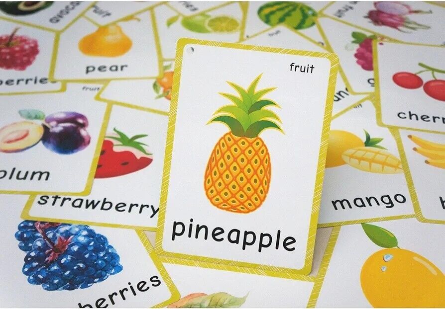 Colorful English fruit flash cards featuring a variety of fruits like pineapple, strawberry, and mango.