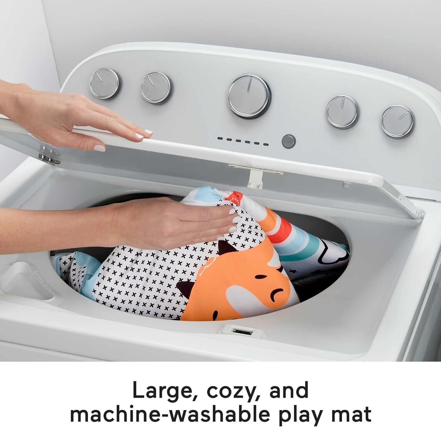 Fisher Price 3 in 1 gym newborn playset being placed in a washing machine for easy cleaning