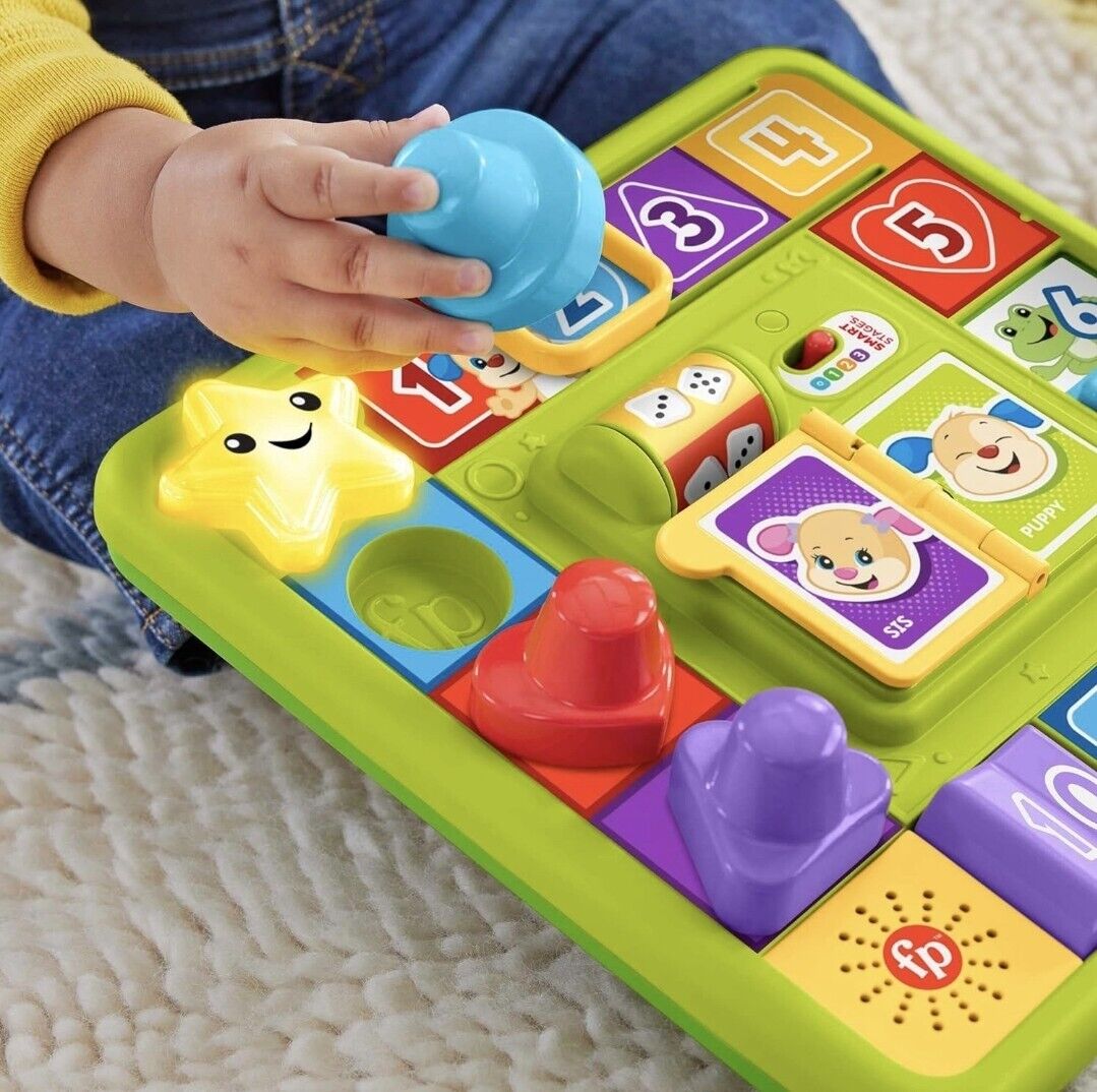 Fisher-Price interactive activity board with brightly coloured shapes and fun educational features for toddlers