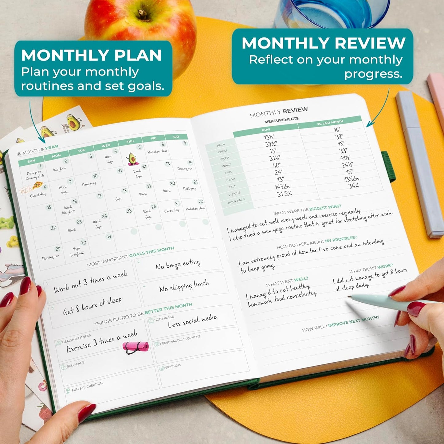 Clever Fox fitness and food journal open on a table with notes for monthly planning and review