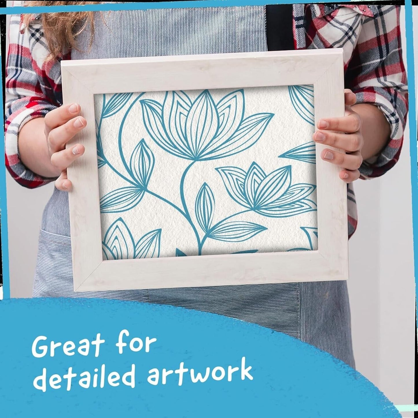 Person holding a framed artwork created with blue metallic paint markers, ideal for detailed projects