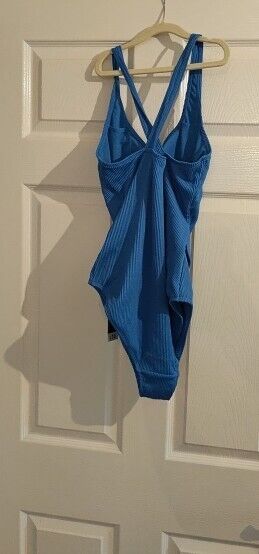 George womens blue swimsuit size 14 hanging on a hanger against a plain background