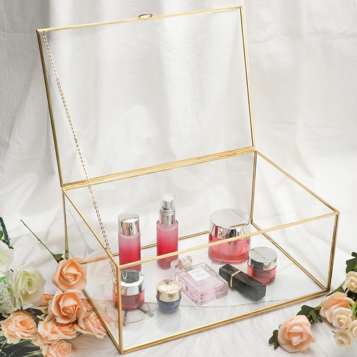 Homtone gold glass terrarium box opened, showcasing beauty products inside on a soft white background
