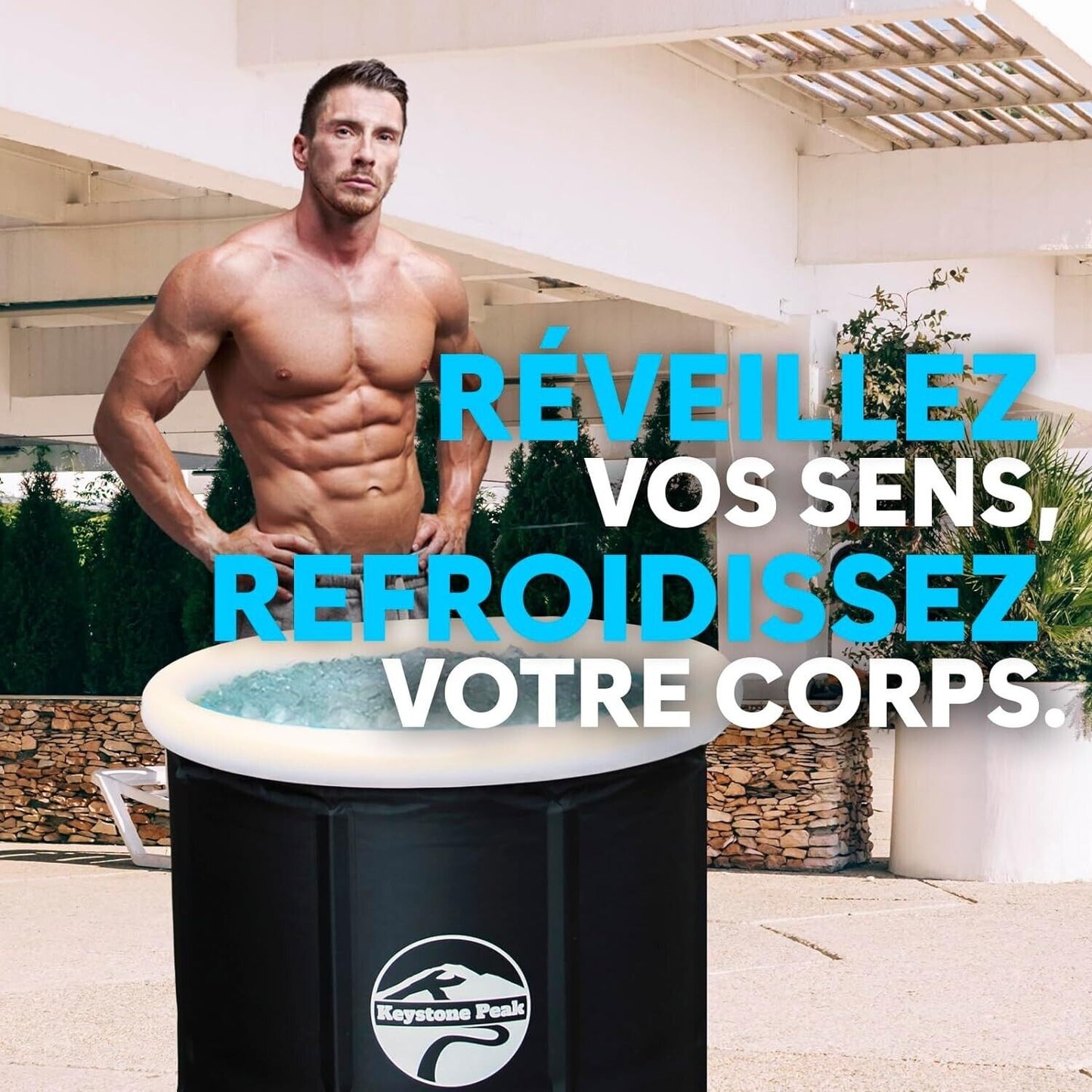 Keystone Peak recovery bath shown with a muscular man standing beside it for optimal relaxation