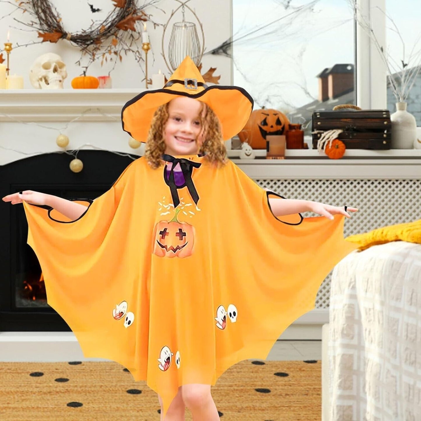 Child in an orange kids Halloween bat costume with a pumpkin design and a matching hat