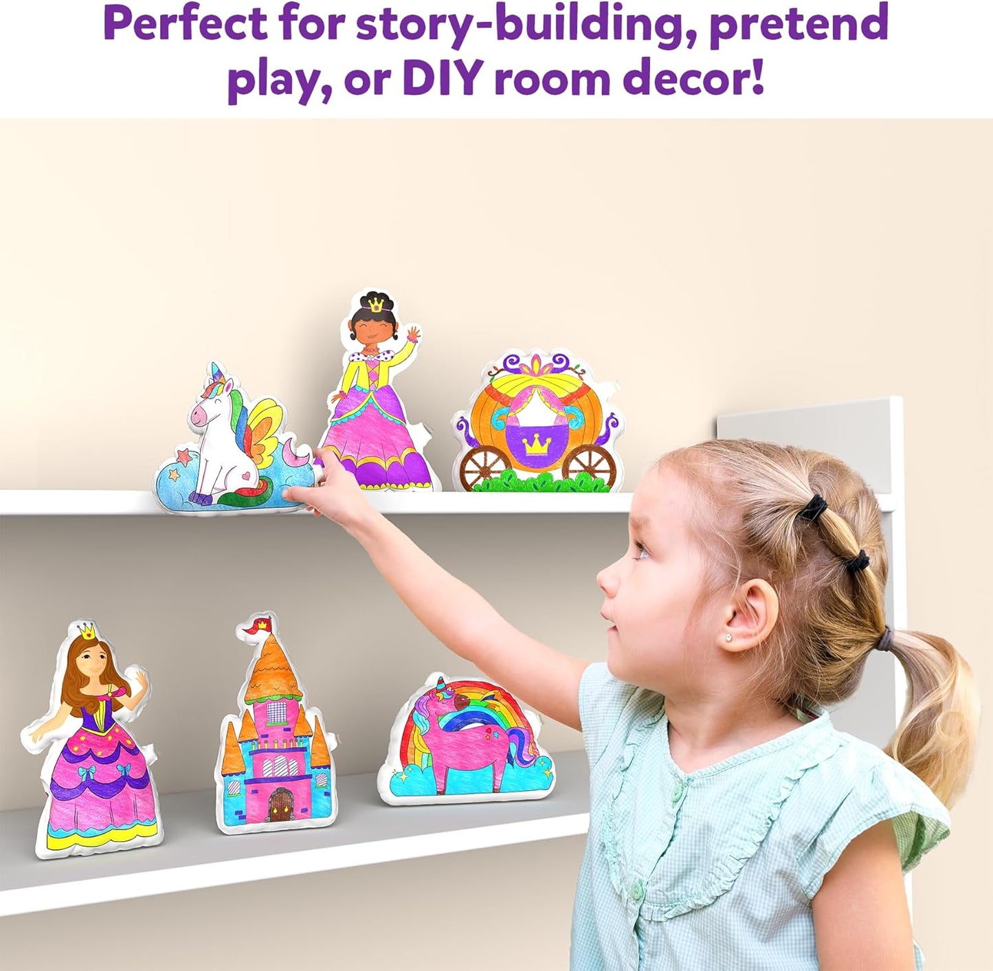 Child using the inflatable art kit for kids to create decorative story elements on a shelf
