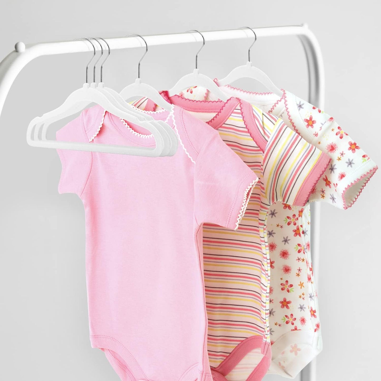 MangoKit kids velvet hangers 30 pack displaying colourful baby bodysuits neatly organised