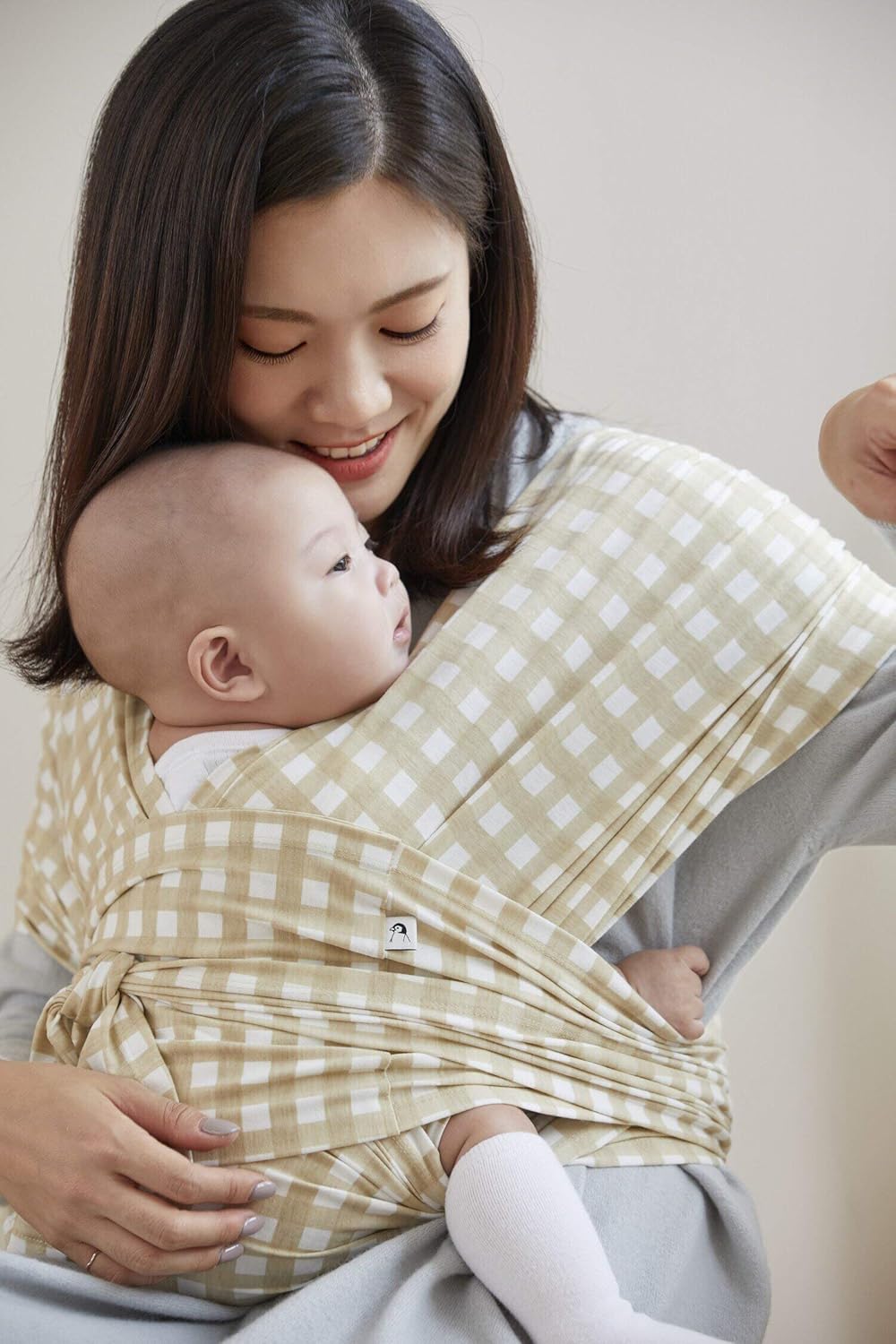 Konny lightweight infant carrier for mums in a soft checkered design, providing comfort for parents and babies