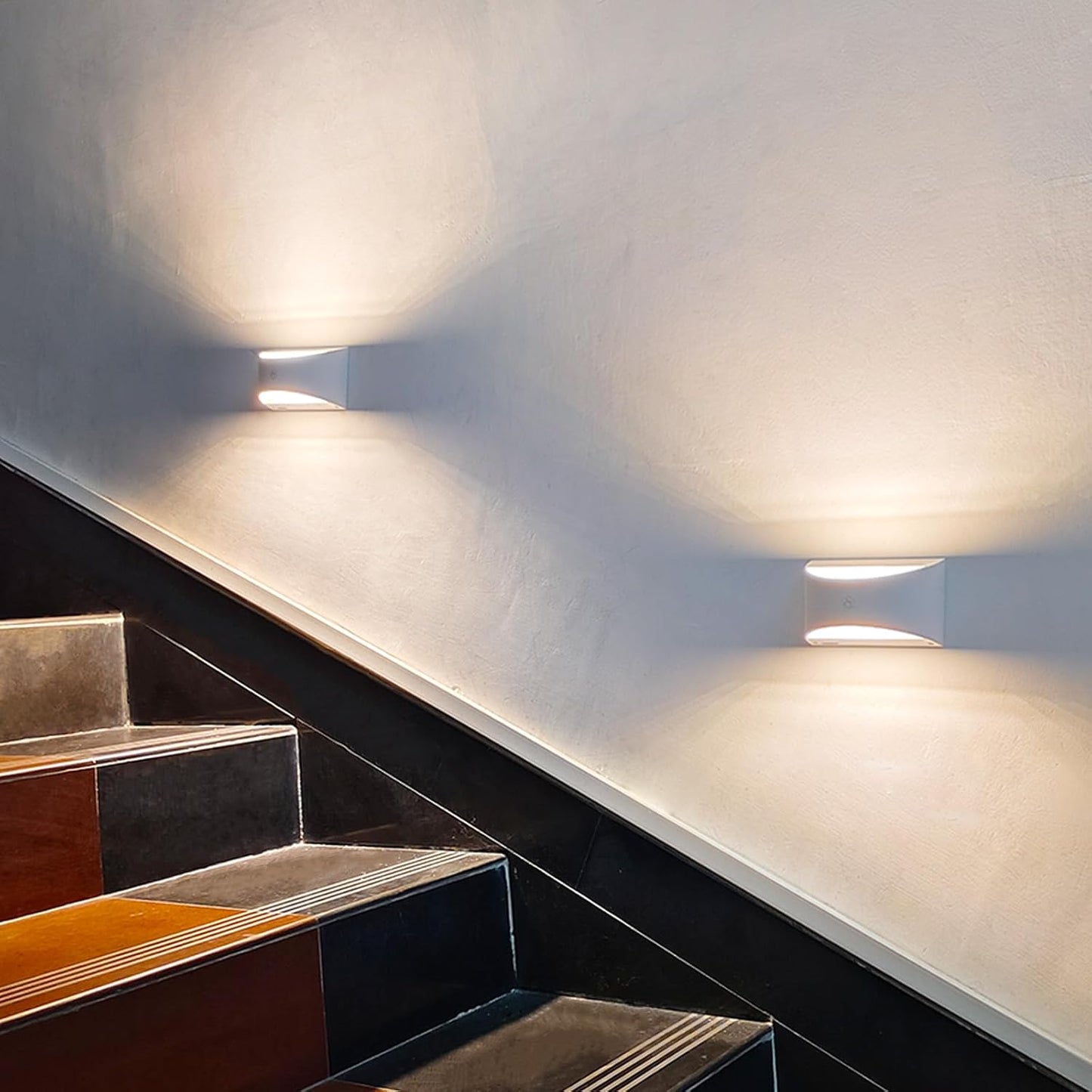 Joyes LED rechargeable wall lights illuminating a staircase for safe navigation