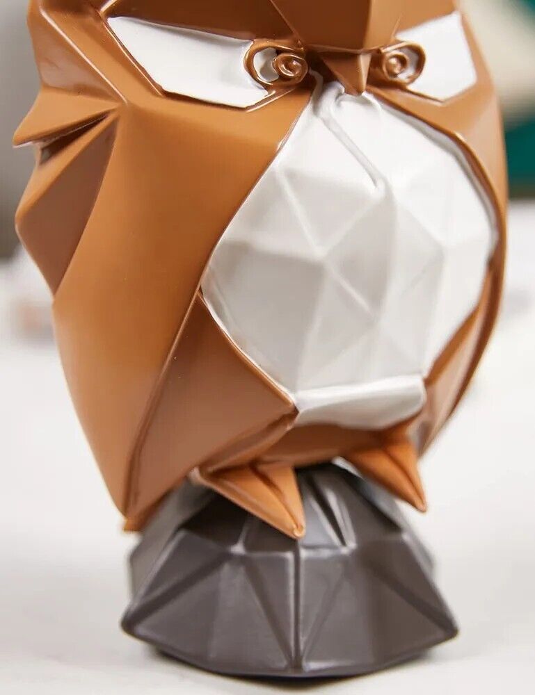 Stylish modern owl sculpture in brown and white with geometric design details