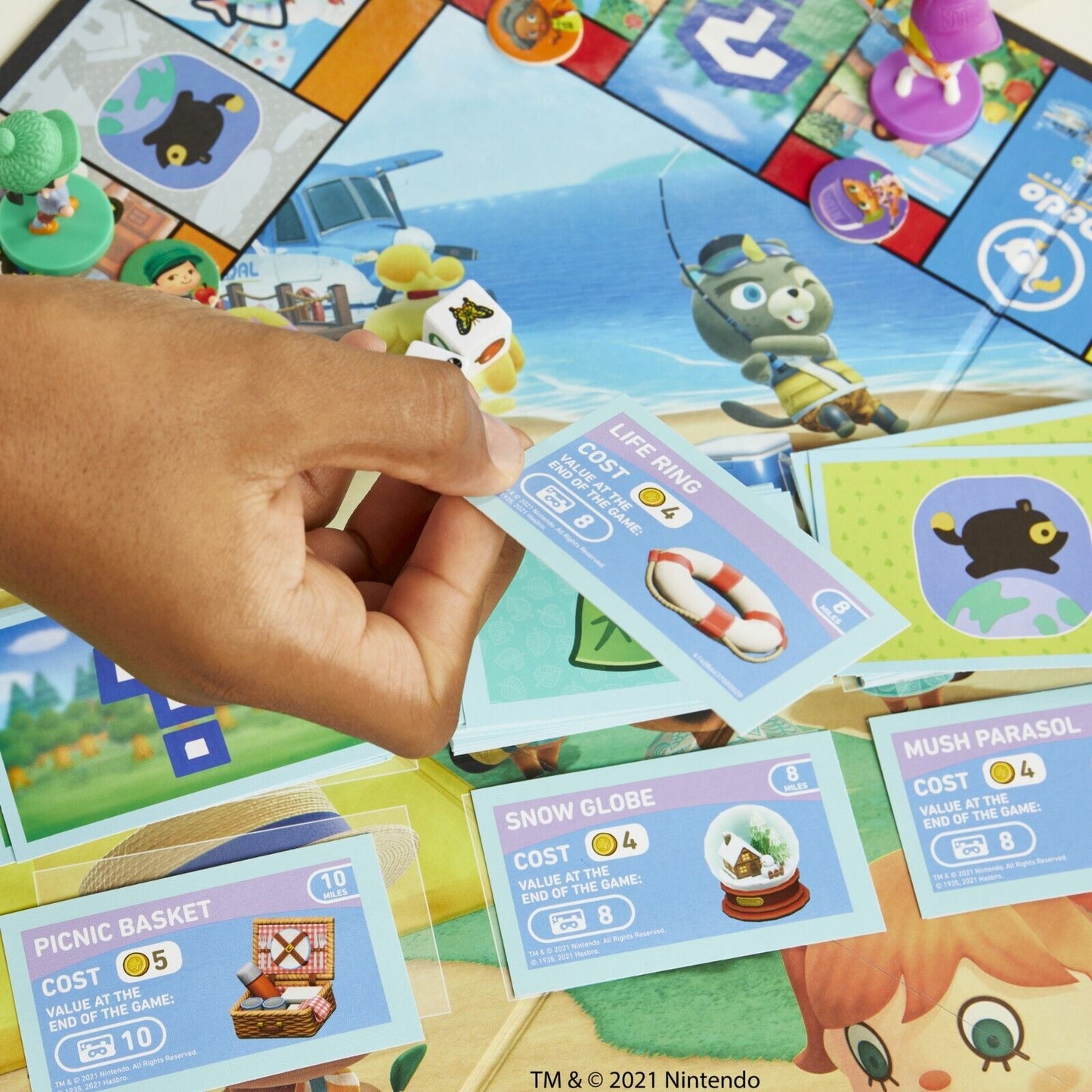 Monopoly Animal Crossing Game with colorful game board, character tokens, and property cards in use
