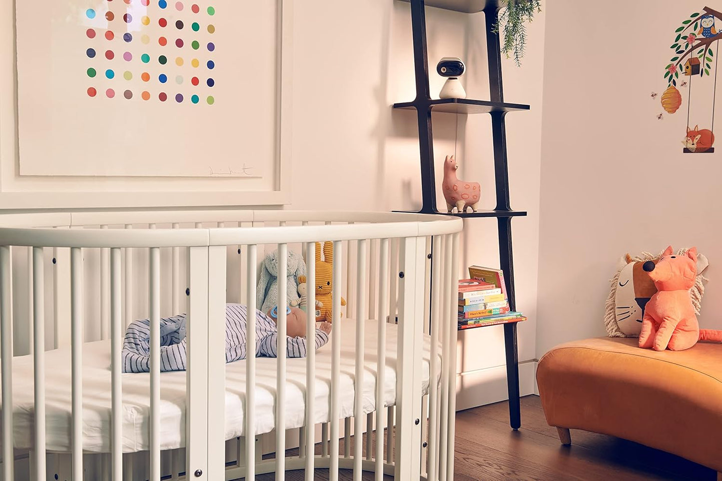 Motorola video baby monitor in a stylish nursery with a crib and soft toys