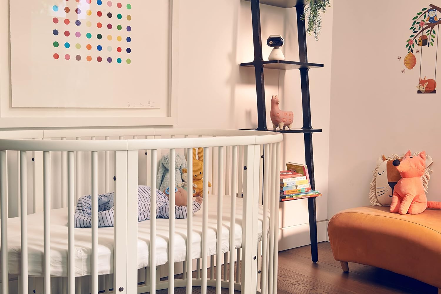 Motorola video baby monitor in a stylish nursery with a crib and soft toys