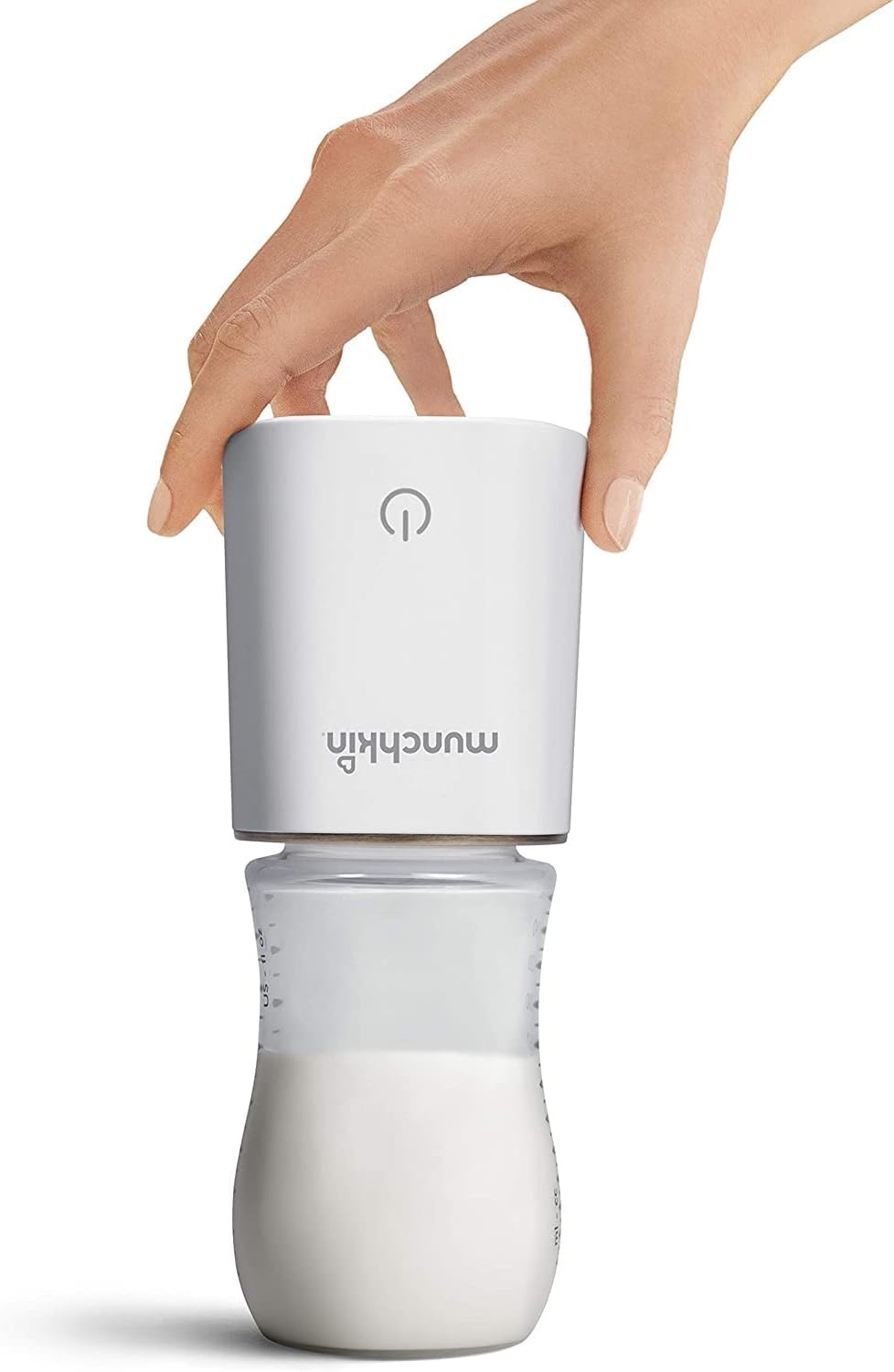 Munchkin digital baby bottle warmer in use, heating a bottle with a sleek design