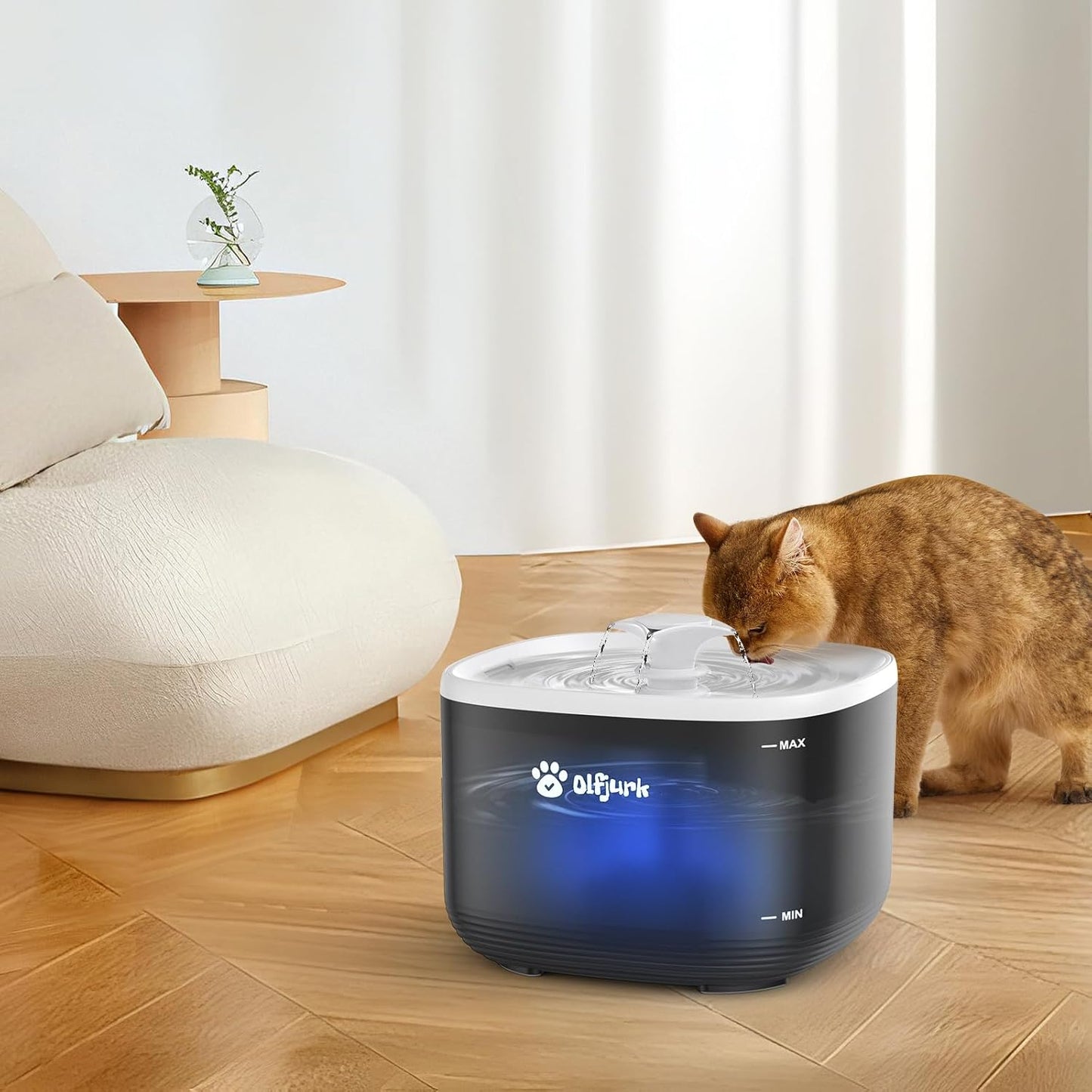 Olfjurk automatic pet water fountain with a cat drinking water in a modern living room setting