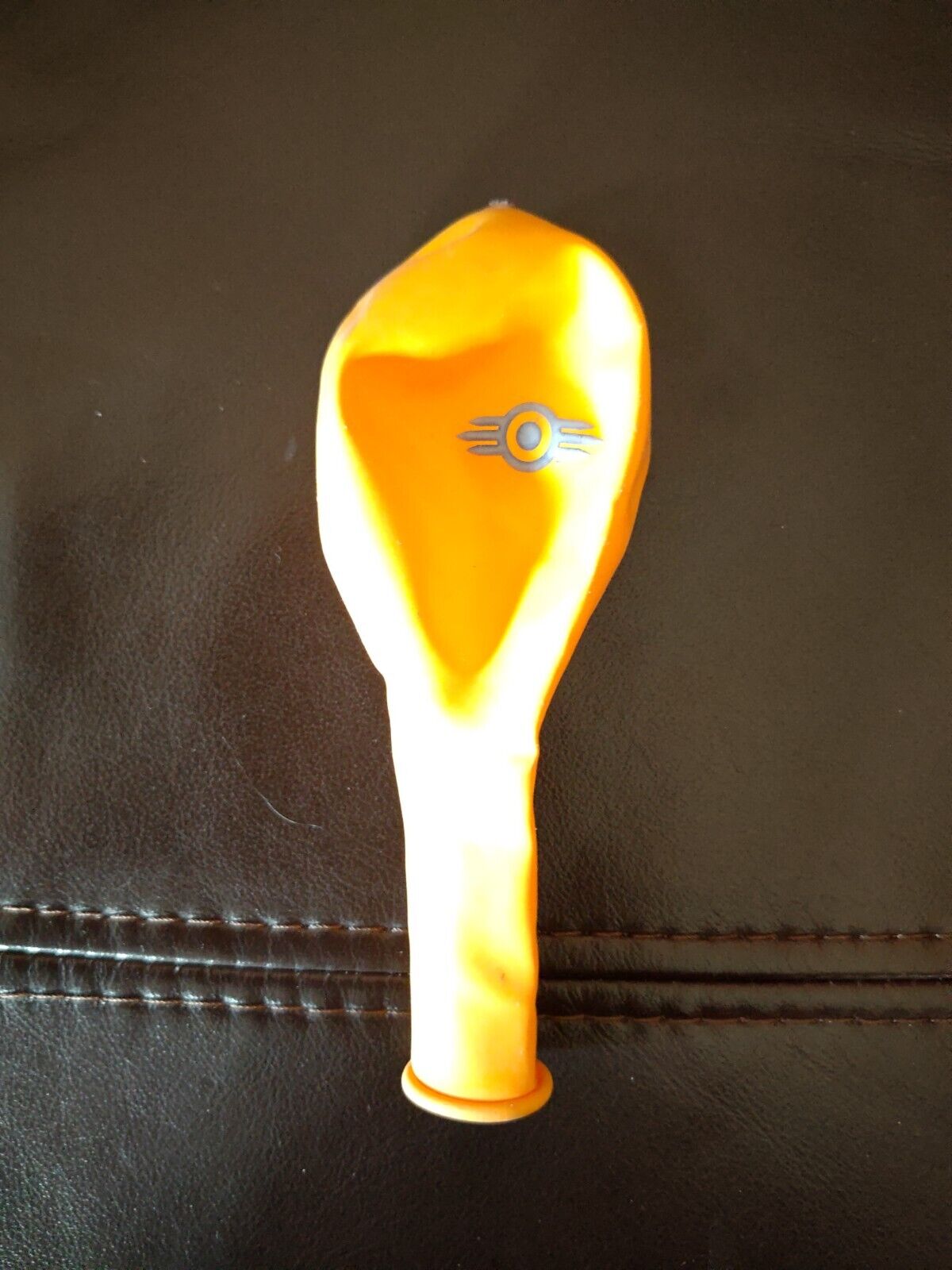 Bethesda yellow homeware balloon with vault symbol on dark background