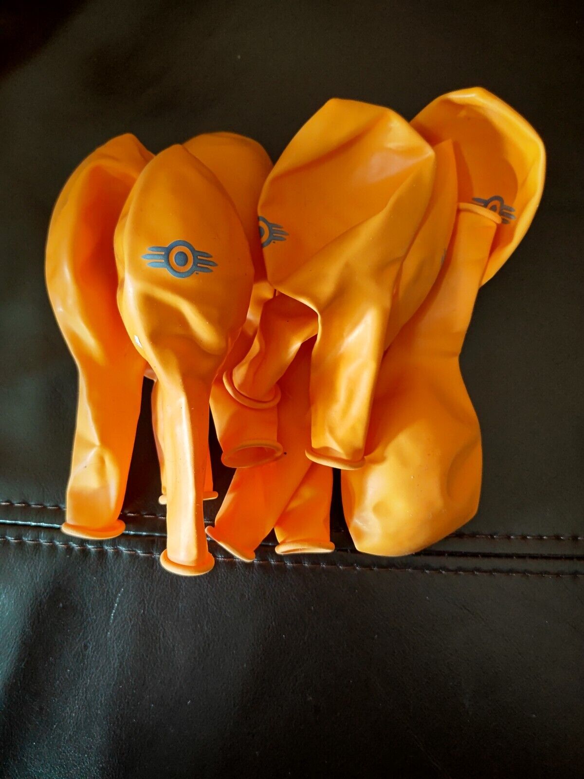 Bethesda orange latex balloons with Vault Boy logo, ideal for homeware party decorations