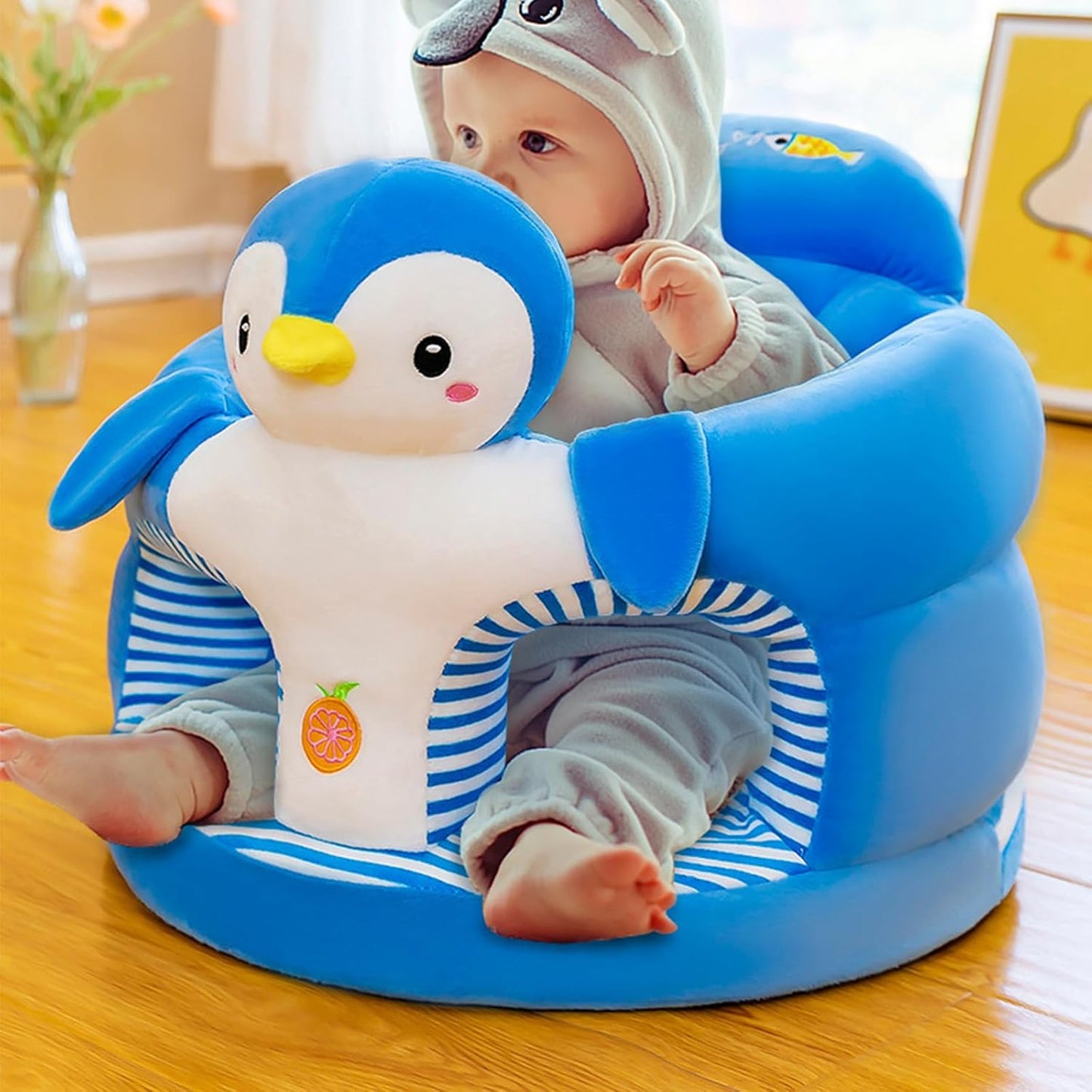 Penguin baby seat in blue with playful design, perfect for toddlers learning to sit comfortably