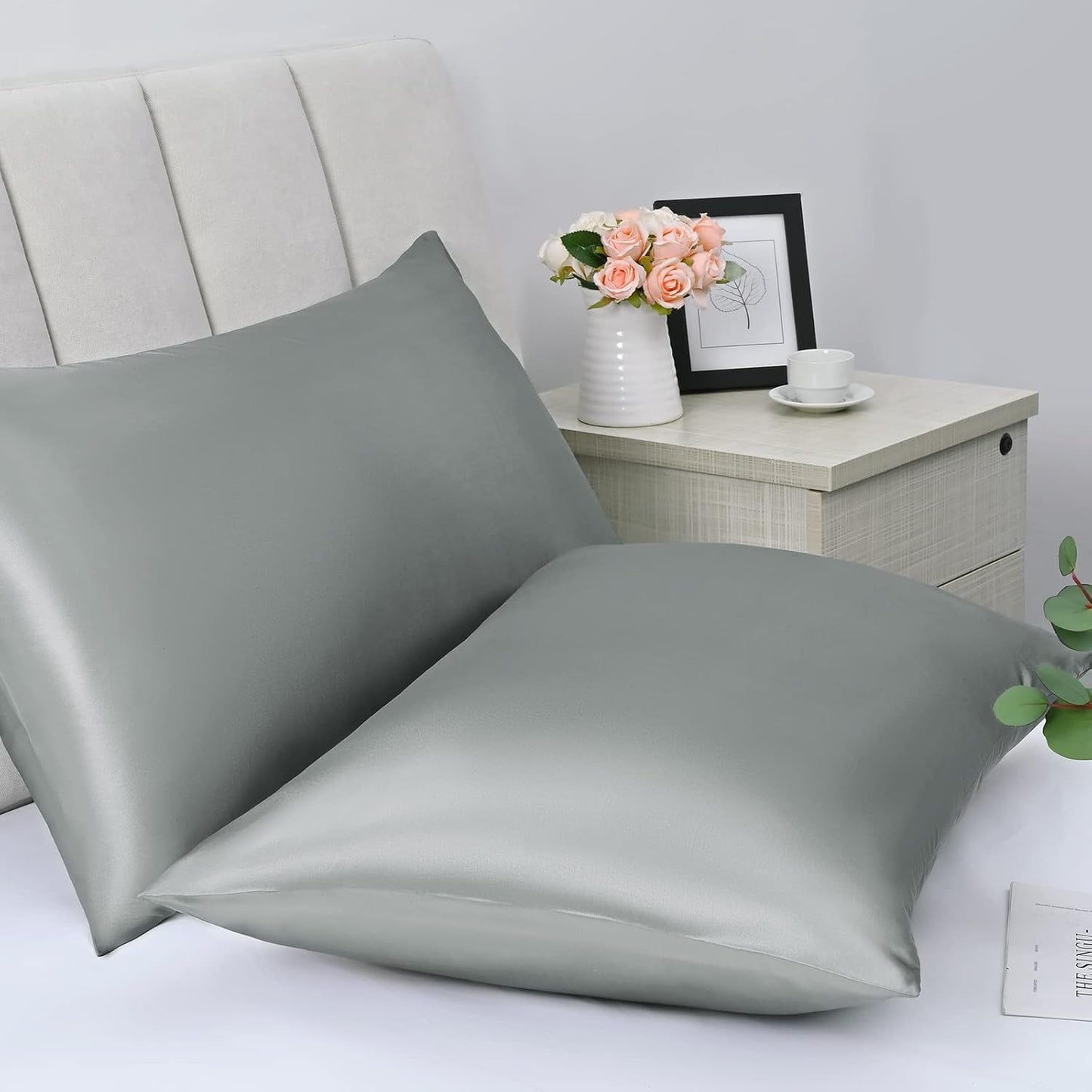 Bedcozy satin pillowcase for hair and skin in soft grey colour on a neatly made bed