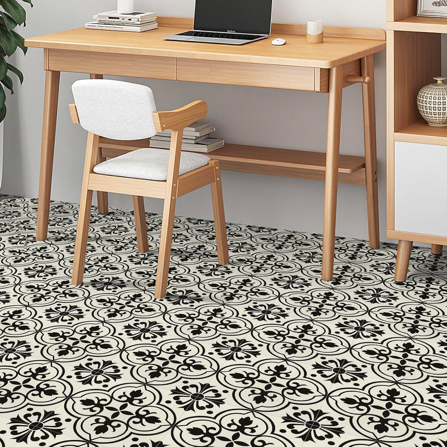Stylish NUFLR self adhesive floor tiles 30cm x 30cm featuring a black and white floral pattern in a modern workspace