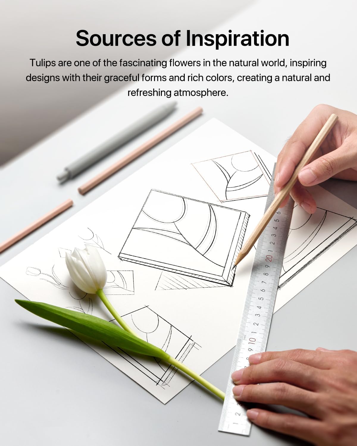 Self adhesive sound proofing panels displayed on a design sketch table with a tulip