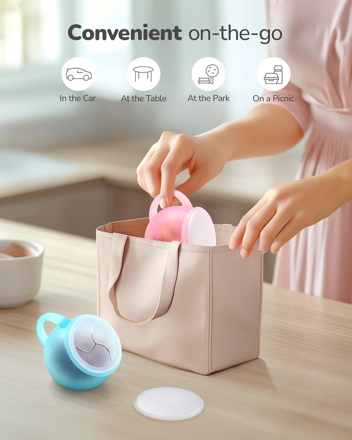 Jelly Ruru spill proof toddler snack cup pink being packed into a reusable bag for convenient use