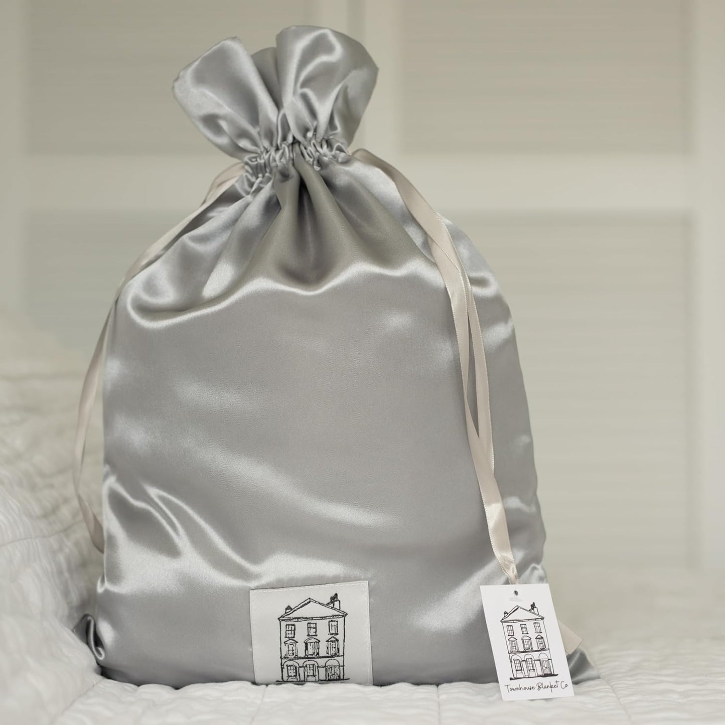 Elegant storage bag for the blue baby chenille blanket with satin finish and stylish drawstring closure