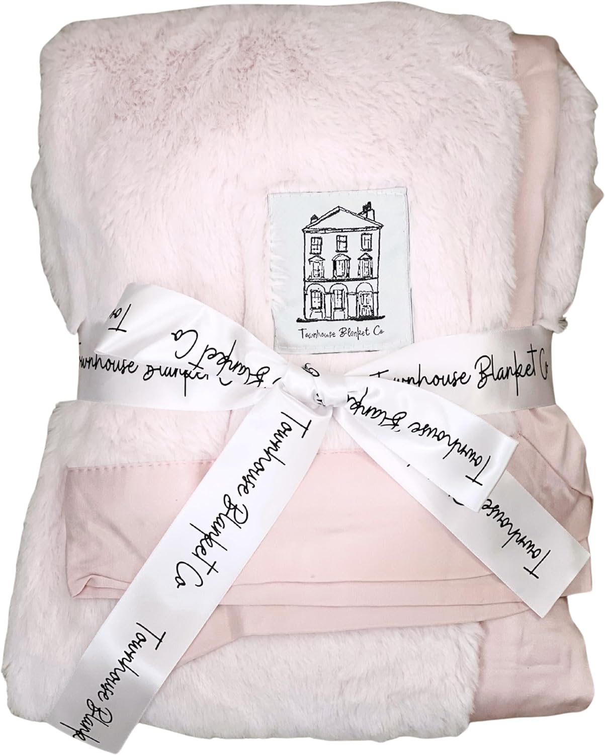 Soft pink baby chenille blanket by Townhouse Blanket Co wrapped in a stylish ribbon