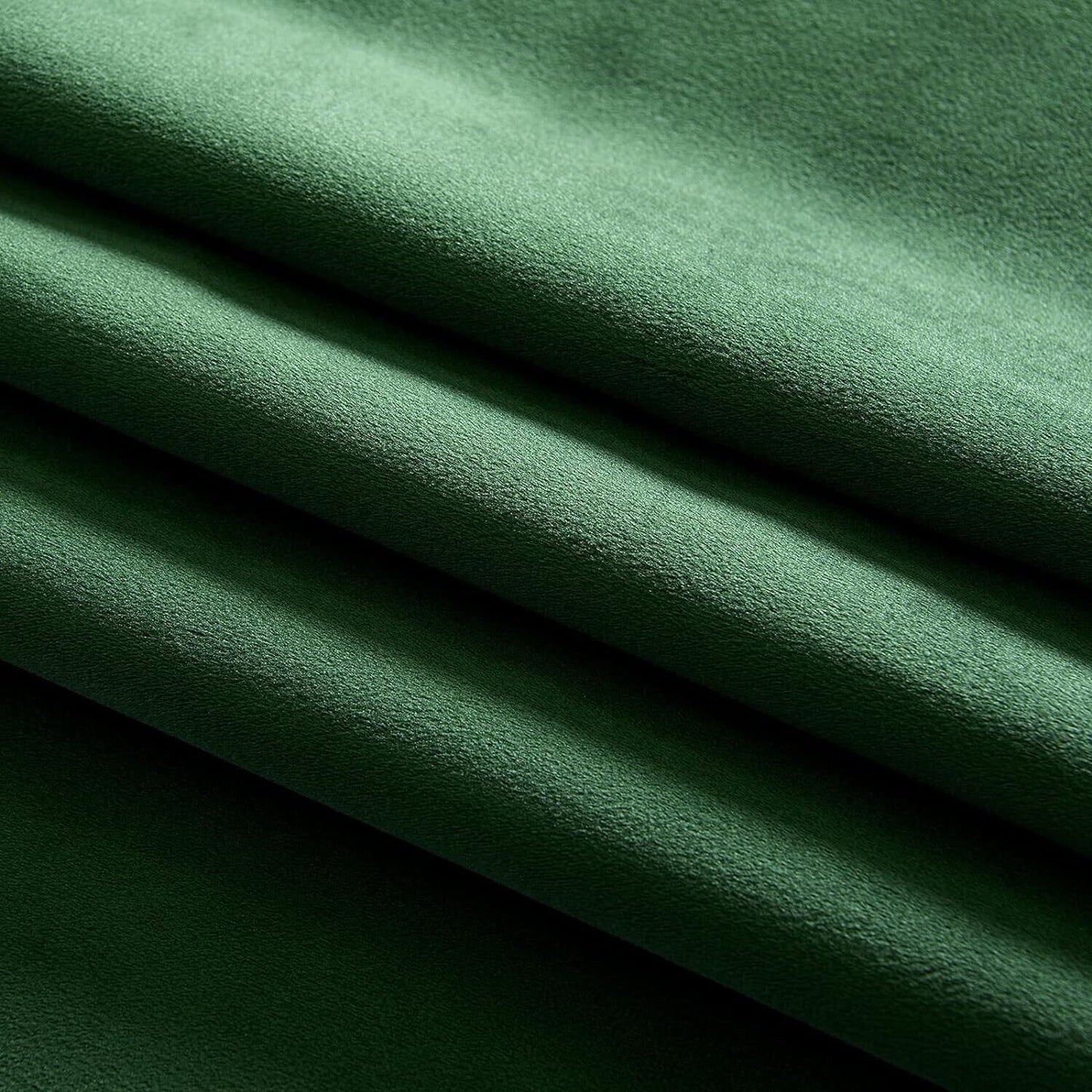 Luxurious green velvet blackout curtains for optimal light blocking and privacy