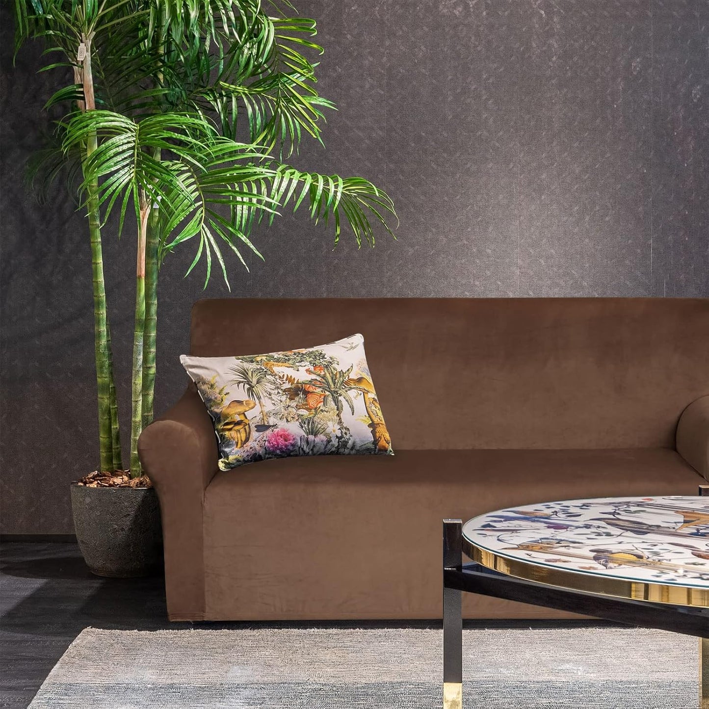 Elegant velvet loveseat cover chocolate on a modern sofa with decorative cushions and greenery