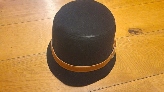 Black 1940s vintage womens hat with a brown leather band for retro style lovers