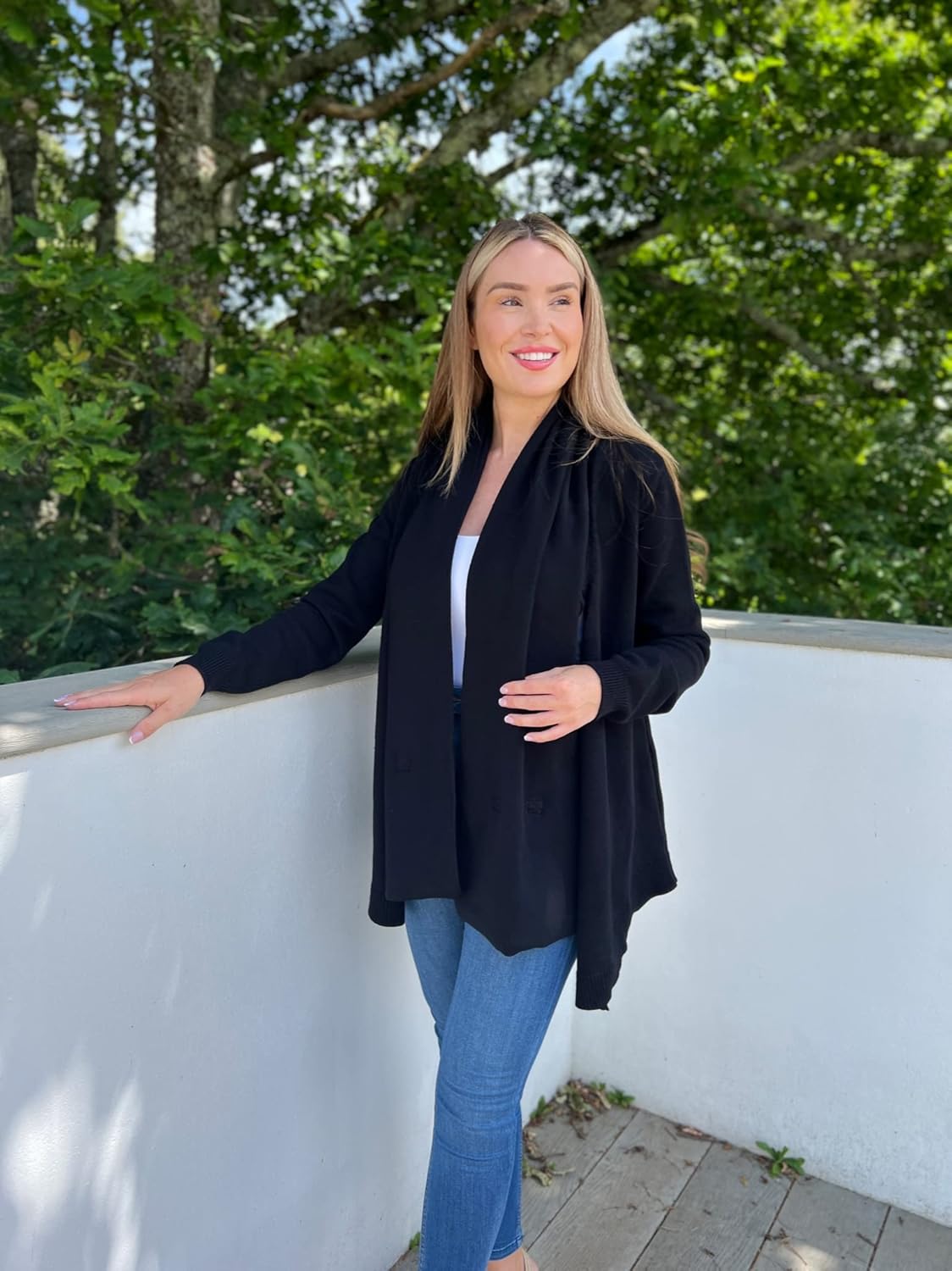 Chic black maternity cardigan with baby carrier perfect for stylish parenting