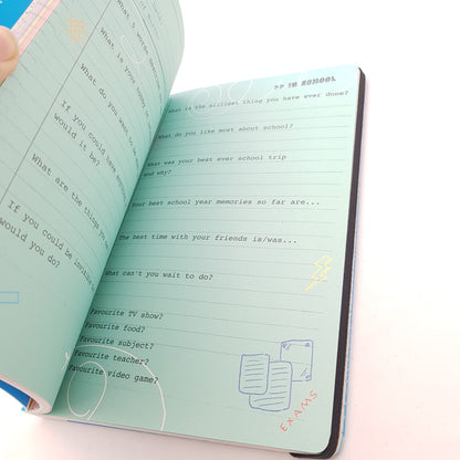 All About Everybody birthday memory book bundle open to school-themed prompts with pastel green pages