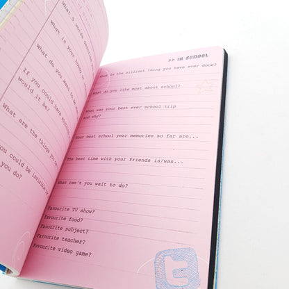 Open pink birthday memory book bundle page with prompts for school year and favorite activities by All About Everybody