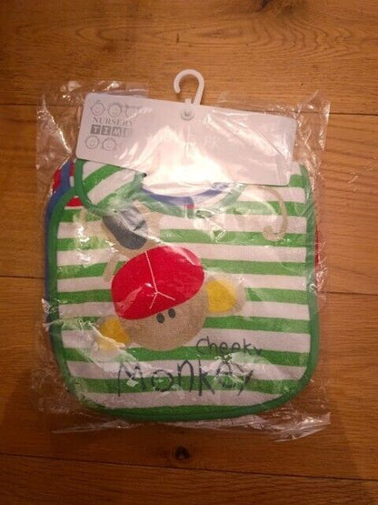 Pack of colourful baby bibs set with a playful monkey design for mealtime protection