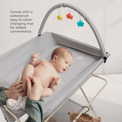 Goozie baby changing table with wheels featuring a waterproof changing mat for added convenience