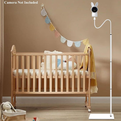 Baby monitor floor stand in a nursery with a crib and colorful garland for easy viewing