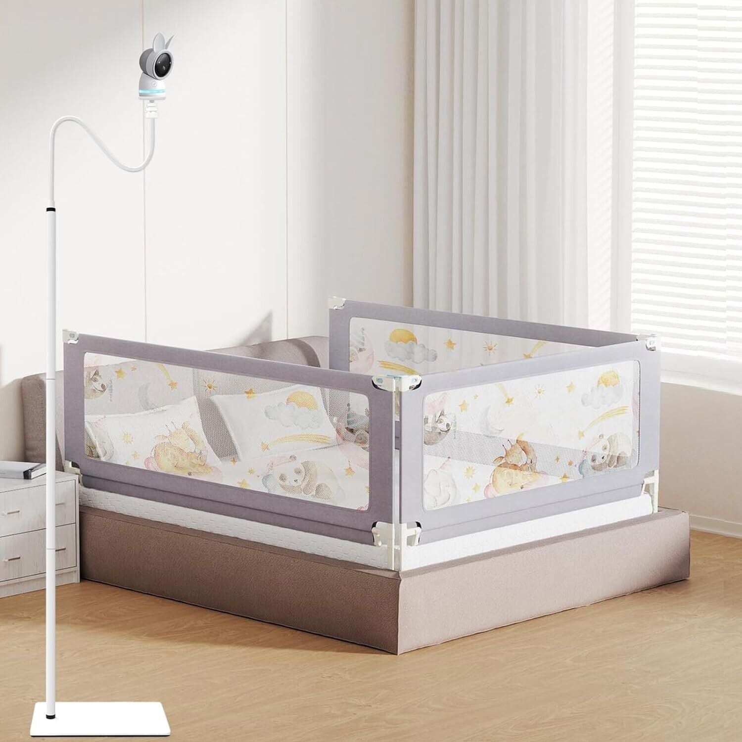 Baby monitor floor stand securely positioned next to a crib in a softly lit nursery