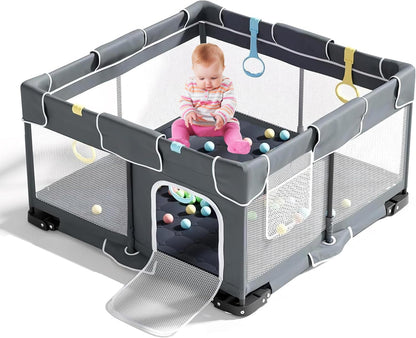 Plurimo baby playpen 127x127cm in grey with colourful accessories and a child playing inside
