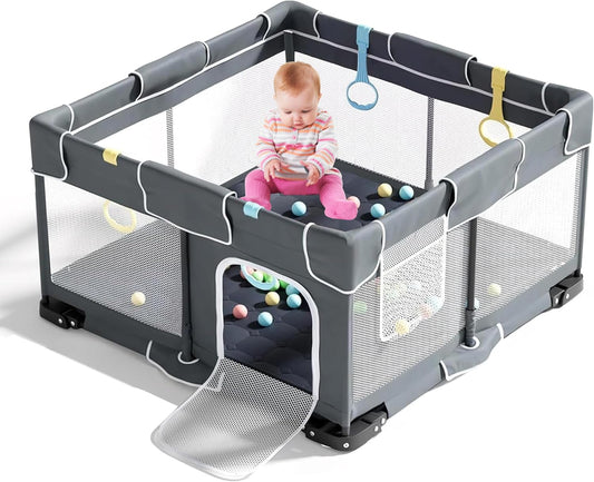Plurimo baby playpen 127x127cm in grey with colourful accessories and a child playing inside