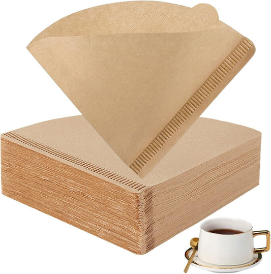 ByKitchen disposable coffee filters for drip coffee in a stack with a cup of brewed coffee