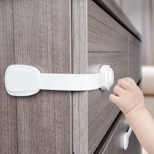 Child safety cabinet locks securely fastening a drawer to prevent accidents for young children