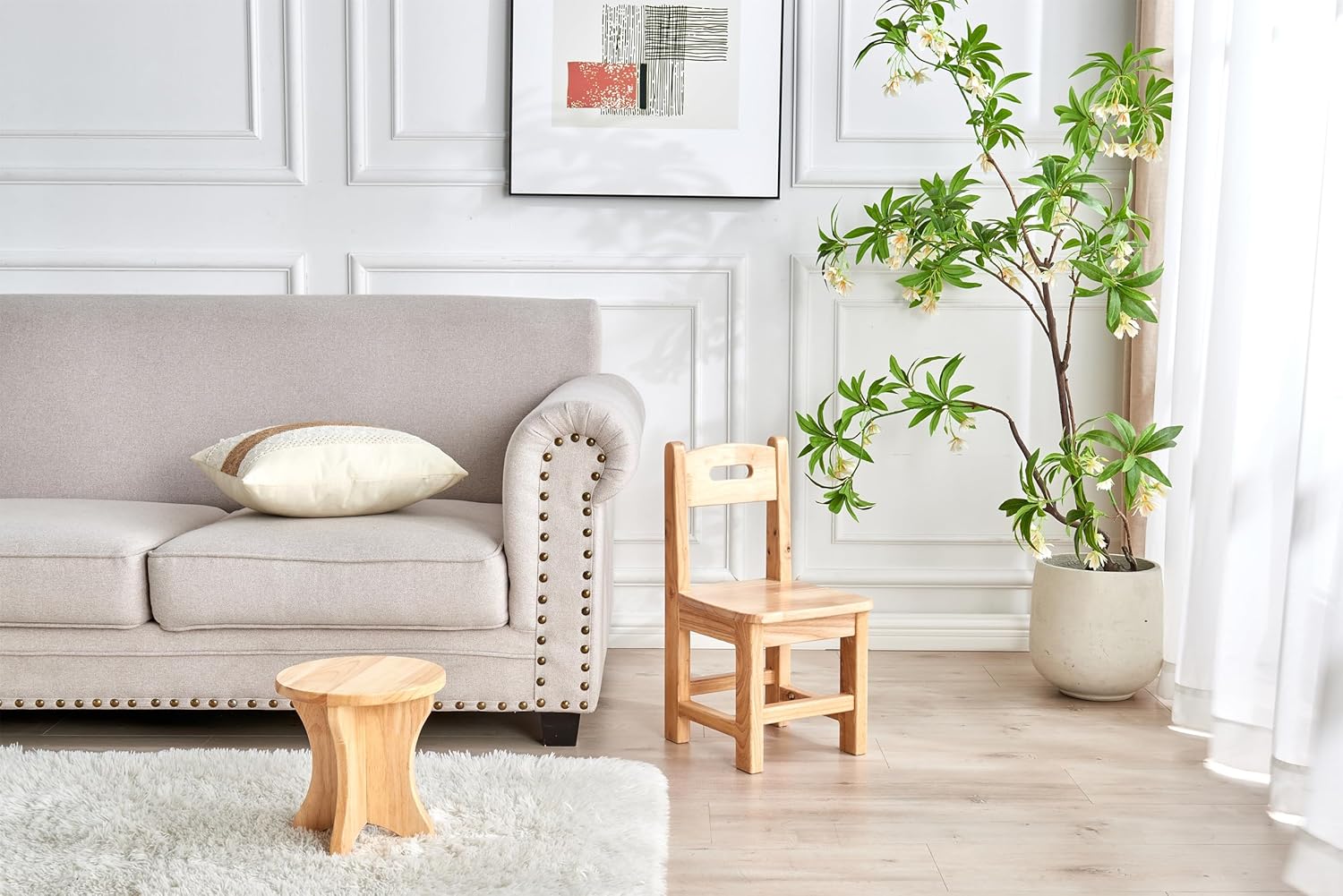 Children's wooden chair and stool set in a stylish living room with plants and a soft rug
